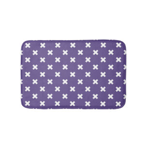 White cross stitches on ultra violet bath mat