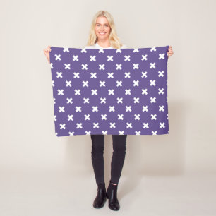 White cross stitches on ultra violet fleece blanket