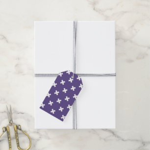 White cross stitches on ultra violet gift tags