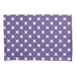 White cross stitches on ultra violet pillowcase