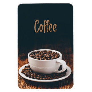 White cup full of roasted coffee beans magnet