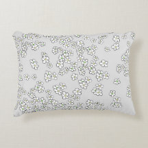 White daisies on red and grey decorative cushion