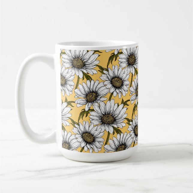 White daisies, wild flowers on yellow coffee mug (Left)