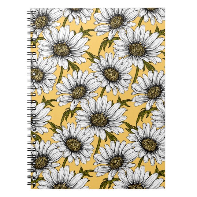 White daisies, wild flowers on yellow notebook (Front)