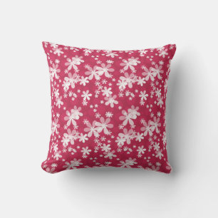 White daisy flowers on a red background cushion