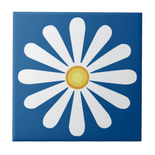 White daisy, yellow centre, on lapis blue tile
