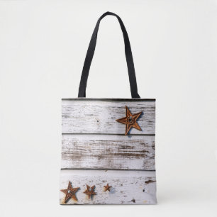 White distressed wood with stars on a tote bag