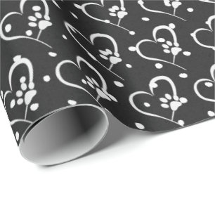 white dog paw prints on heart wrapping paper