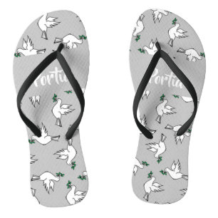 White dove with green leaves on grey flip flops