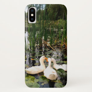 White ducks, lily pads, cattails, lake shore iPhone x case