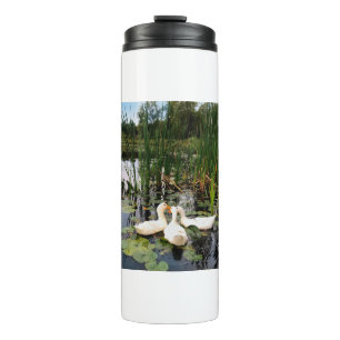 White ducks, lily pads, cattails, lake shore thermal tumbler