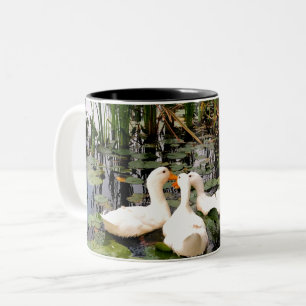 White ducks, lily pads, cattails, lake shore Two-Tone coffee mug