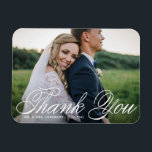White Elegant Photo Wedding Thank You Magnet<br><div class="desc">Celebrate your love and show gratitude with our customisable photo wedding thank you magnet! This unique keepsake is perfect for reminding your loved ones of your special day while expressing your heartfelt thanks in a memorable way. It features an elegant calligraphy and classic typography. You can personalise this elegant wedding...</div>