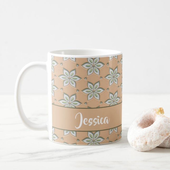 White engraved flowers on tan coffee mug (With Donut)