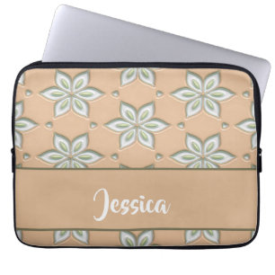 White engraved flowers on tan laptop sleeve