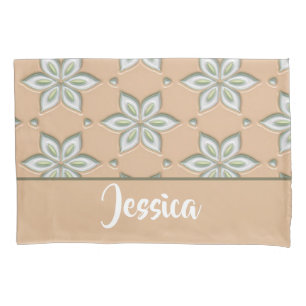 White engraved flowers on tan pillowcase