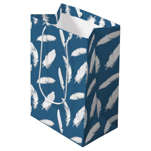 White feather print on denim blue medium gift bag (Front Angled)