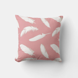 White feather print on shell pink cushion