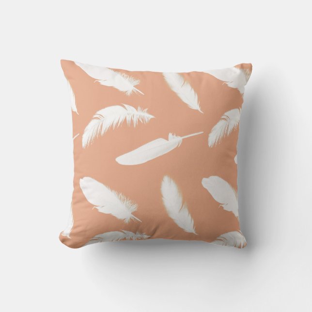 White feather print on soft peach cushion (Front)