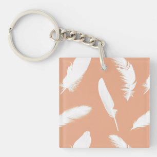 White feather print on soft peach key ring