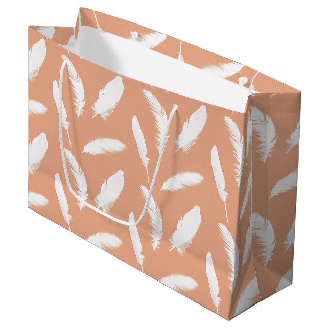 White feather print on soft peach large gift bag (Front Angled)