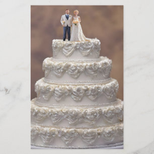 White Five Tier Wedding Cake With Bridal Couple, Stationery