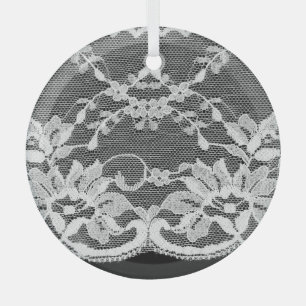 White floral lace: black background. glass tree decoration