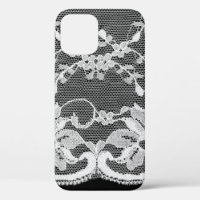 White floral lace on a black background.