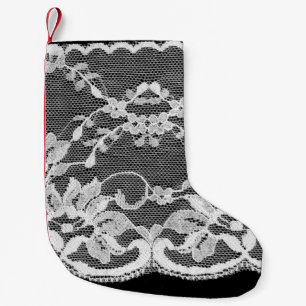 White floral lace on a black background. small christmas stocking