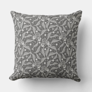 White floral lace on a gray background cushion