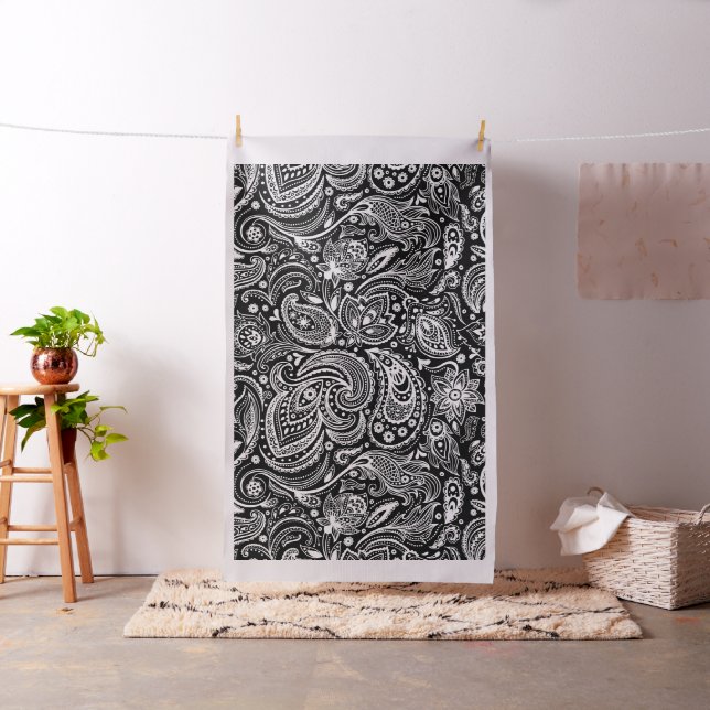 White floral paisley pattern on black fabric (In Situ)