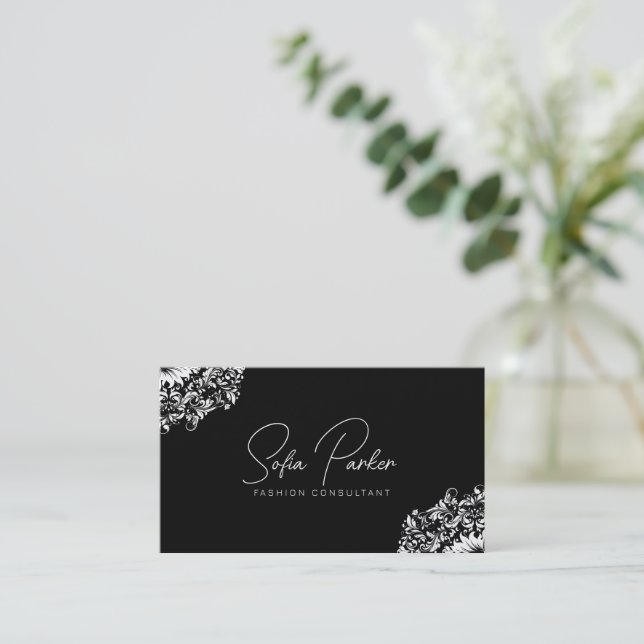 White floral swirl on black business card (Standing Front)