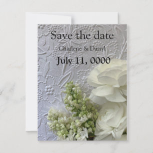 White flowers on embossed background save the date