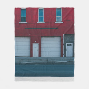 WHITE GARAGE DOORS CLOSED DURING DAYTIME FLEECE BLANKET