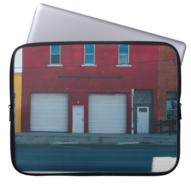 WHITE GARAGE DOORS CLOSED DURING DAYTIME LAPTOP SLEEVE (Front)