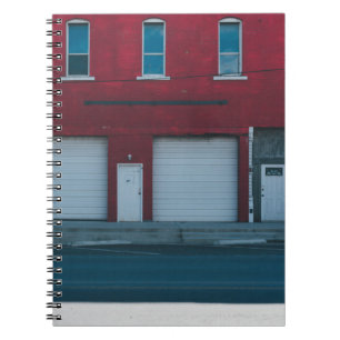 WHITE GARAGE DOORS CLOSED DURING DAYTIME NOTEBOOK