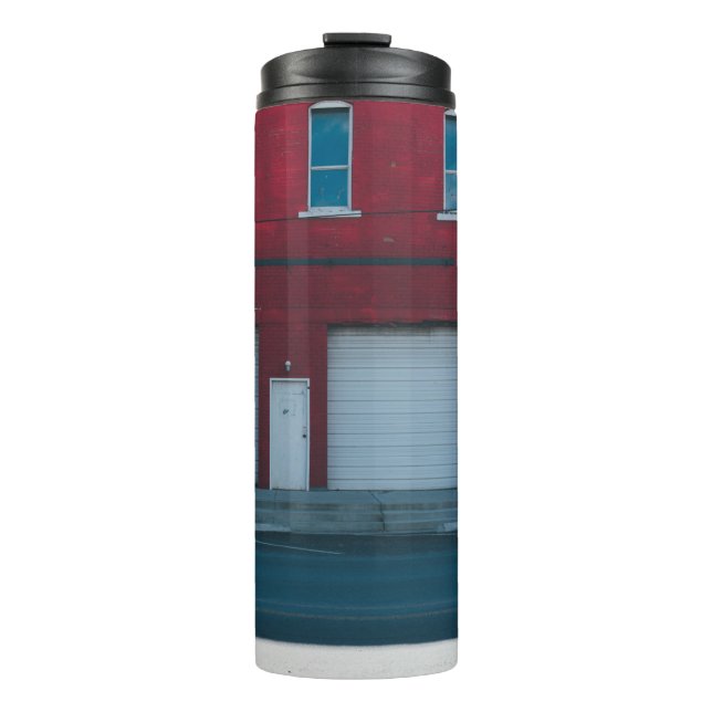 WHITE GARAGE DOORS CLOSED DURING DAYTIME THERMAL TUMBLER (Front)