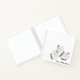 White Gardenia Flowers on White Notebook