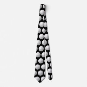 white golf balls on black tie