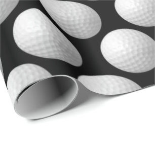 white golf balls on black wrapping paper