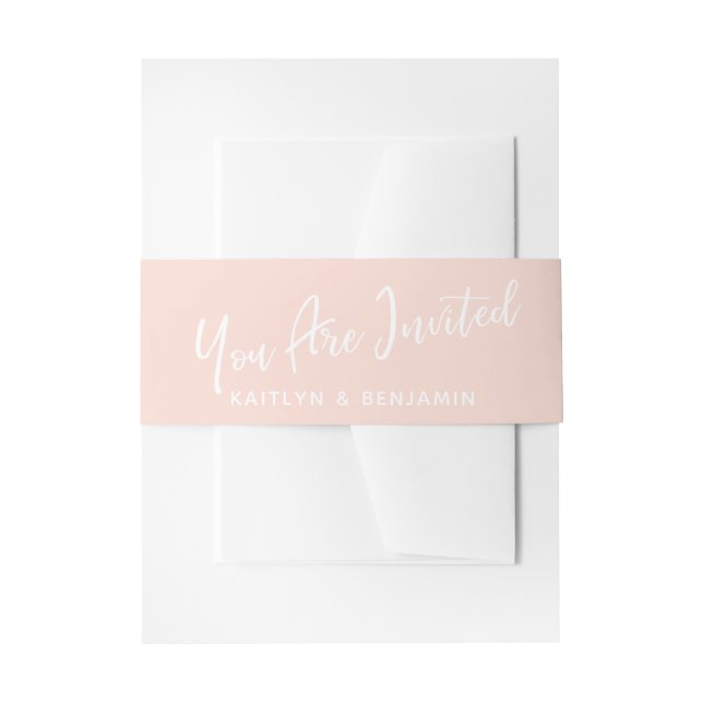 White Handwriting You Are Invited Blush Pink Invitation Belly Band (Front Example)