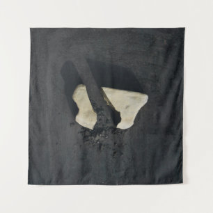 White heart shaped on black surface tapestry