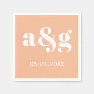White initials typography on coral peach wedding napkin