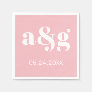 White initials typography on pink wedding napkin