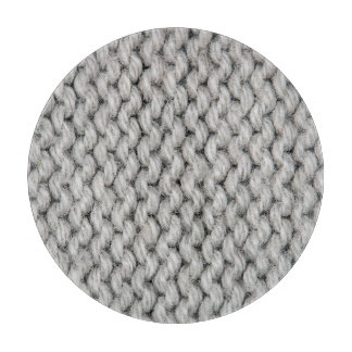 White knitted wool texture, close-up photo. cutting board