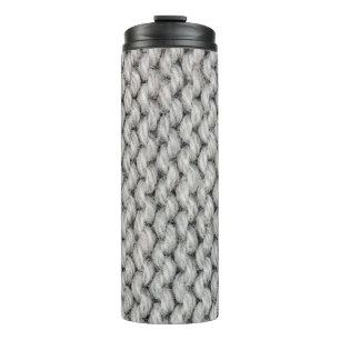 White knitted wool texture, close-up photo. thermal tumbler