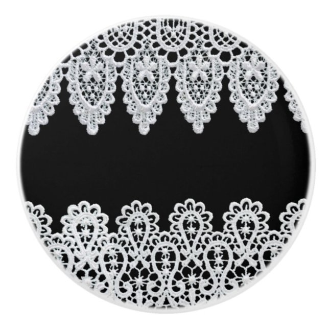 White lace forms a delicate border against black ceramic knob (Front)