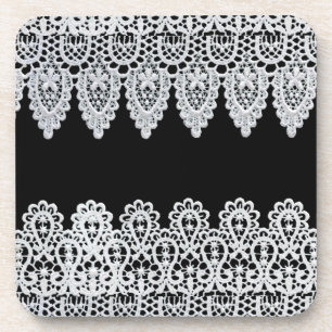 White lace forms a delicate border against black coaster
