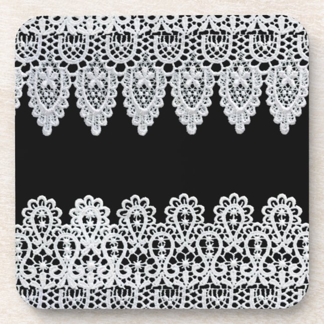 White lace forms a delicate border against black coaster (Front)