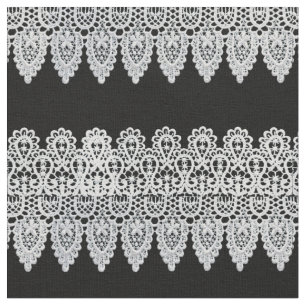 White lace forms a delicate border against black fabric